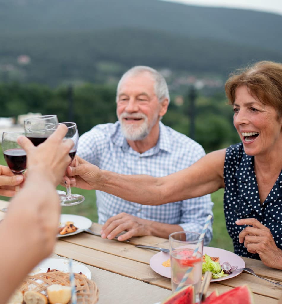 Happy people enjoying wine